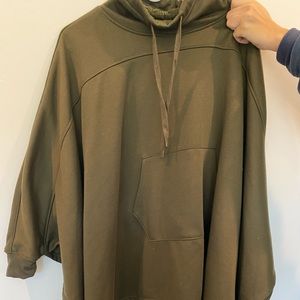 Green poncho with sleeves